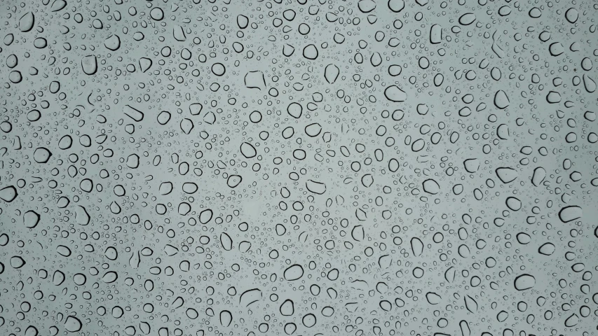 a close up of water droplets on a surface, a stipple, pixabay, minimalism, overcast gray skies, tileable, glass cover, textured plastic