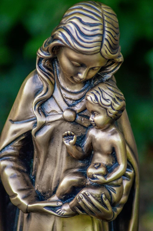 a statue of a woman holding a child, a statue, by Adam Marczyński, unsplash, ornate medieval religious icon, made of bronze, precious moments, resin