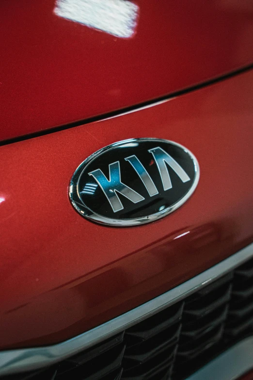 a close up of the front of a red car, kia soul, die - cut sticker, inside of an auto dealership, square