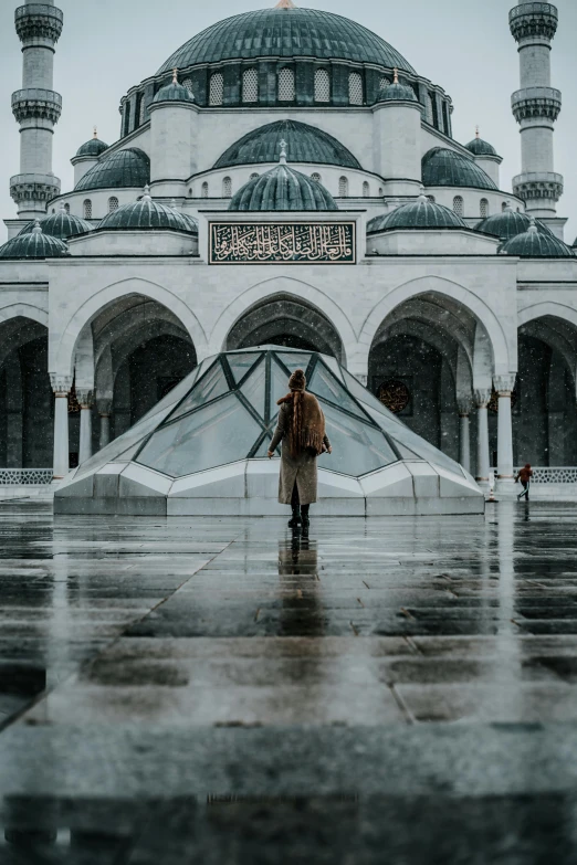 a person standing in front of a large building, unsplash contest winner, arabesque, he is in a mosque, wet climate, russian temple, white marble buildings