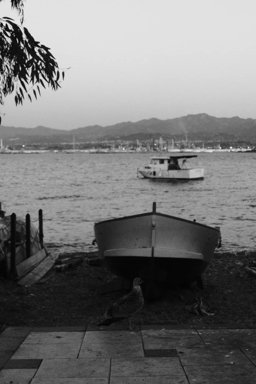 a black and white photo of a boat on the water, a black and white photo, mingei, the city of santa barbara, chiaroscuro!!, 240p, late summer evening