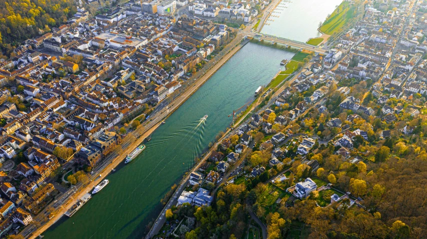 an aerial view of a river running through a city, by Niko Henrichon, pexels contest winner, happening, germany. wide shot, october, high quality print, northern france