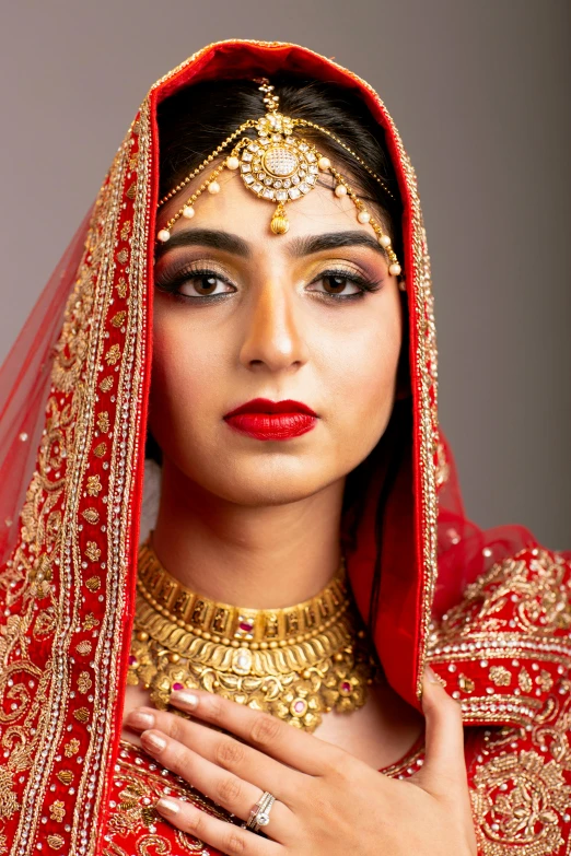 a beautiful indian bride posing for the camera, an album cover, pexels contest winner, renaissance, square, dramatic lighting; 4k 8k, red, middle eastern skin