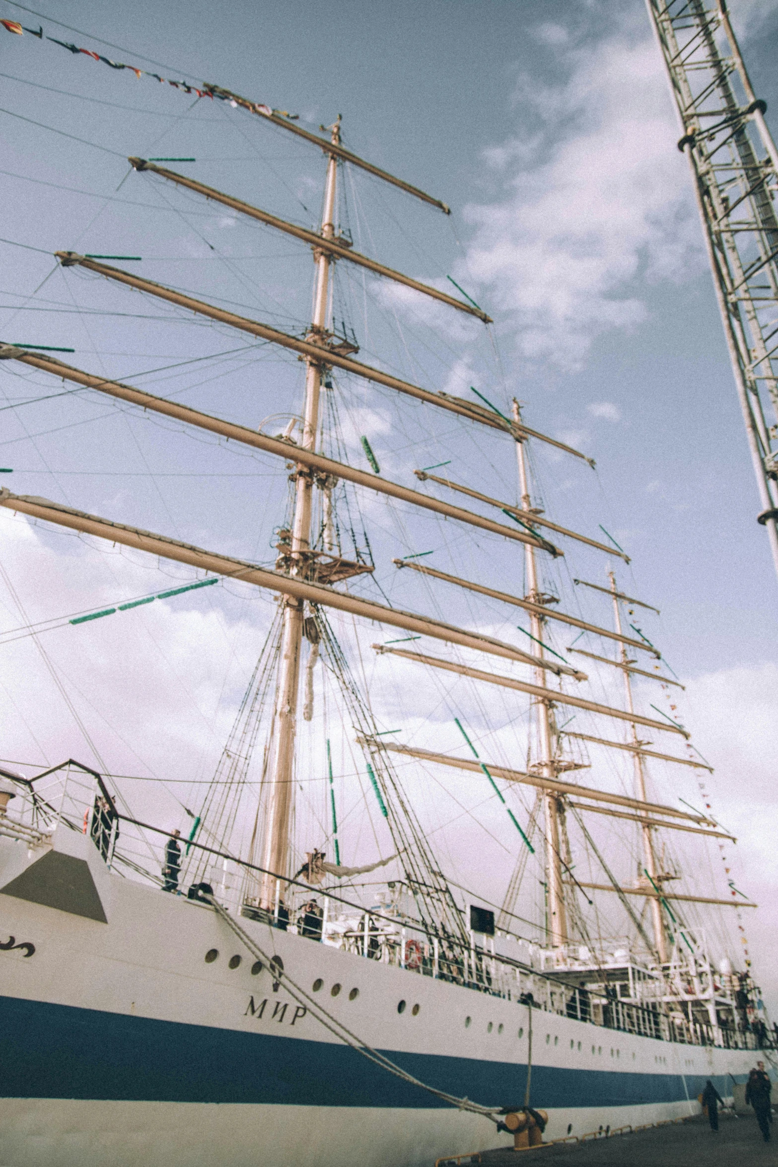 a large boat sitting on top of a body of water, inspired by Josef Navrátil, pexels contest winner, renaissance, standing on the mast, square, stacked image, high technical detail