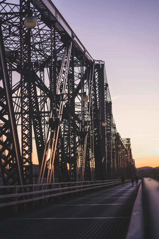 a bridge over a body of water at sunset, by Jacob Burck, unsplash contest winner, renaissance, low detail, hill, industrial aesthetic, napa