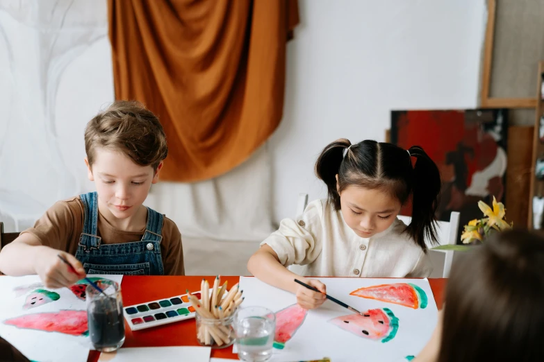 a couple of kids that are sitting at a table, a child's drawing, pexels contest winner, visual art, leaning towards watercolor, symmetrical painting, educational supplies, jpeg artefacts on canvas