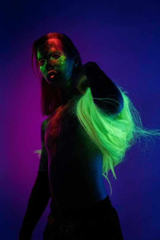 a woman that is standing in the dark, an album cover, inspired by Elsa Bleda, trending on pexels, color field, fresh rainbow bodypainting, long glowing hair, glowing guy creature, non binary model