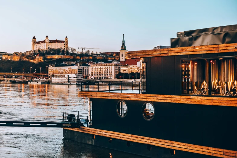 a boat that is sitting in the water, pexels contest winner, danube school, golden cityscape, steamboat willy, exterior view, thumbnail