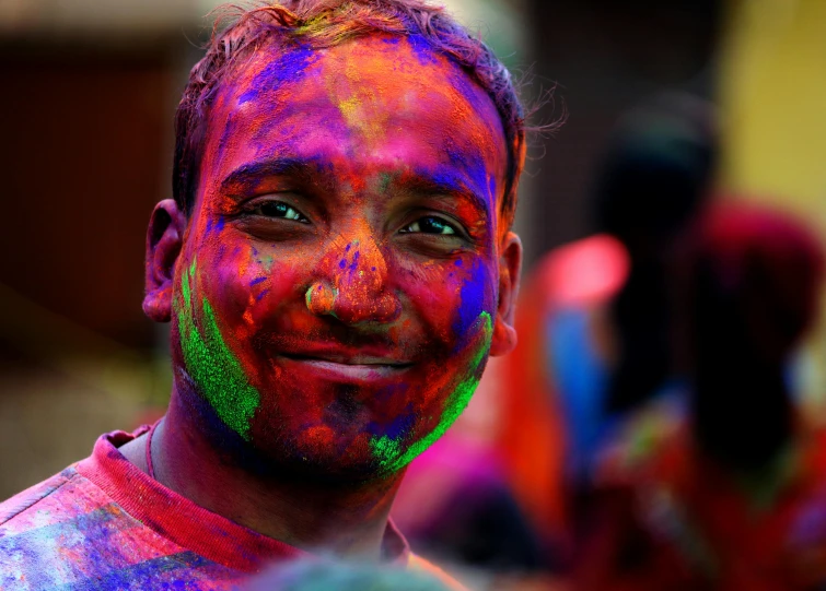 a close up of a person with paint on their face, pexels contest winner, color field, smiling male, hindu aesthetic, a still of a happy, colorful crowd