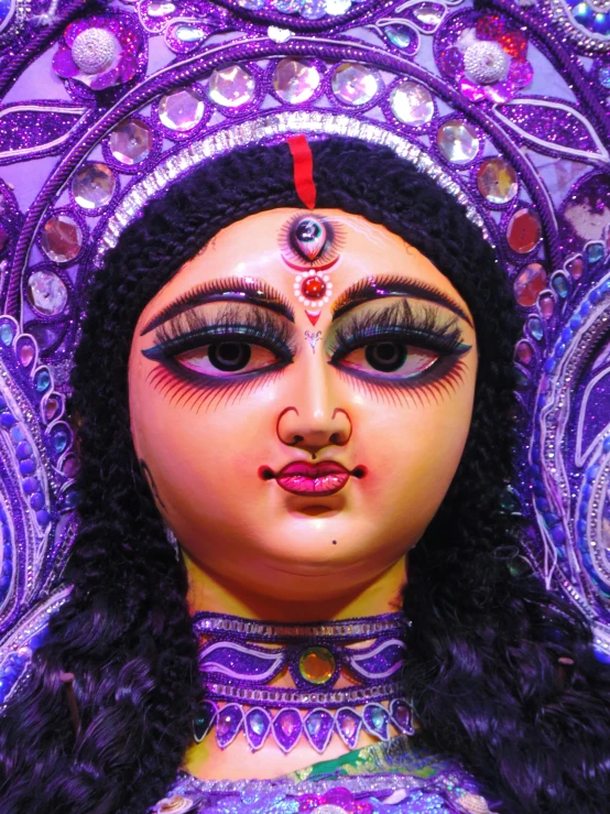 a close up of a statue of a woman, by Sudip Roy, avatar image, large purple eyes, ifa deity, color image