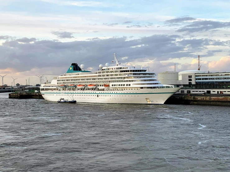 a large cruise ship in a body of water, an album cover, by Thomas Bock, pexels contest winner, renaissance, thames river, verdigris, indian empress, optimus sun orientation