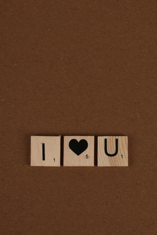 a wooden block with the word i love you written on it, a picture, by Andries Stock, unsplash, letterism, squares, 15081959 21121991 01012000 4k, brown, alessio albi