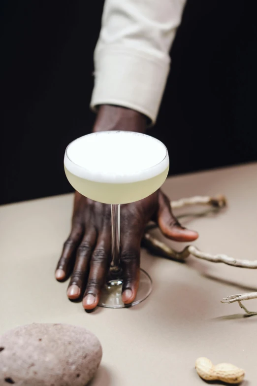 a close up of a person holding a cocktail glass, inspired by Theo Constanté, white wax, obunga, real hands, fertile