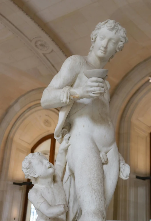 a statue of a man and a dog in a building, a marble sculpture, by Achille Leonardi, trending on unsplash, mannerism, venus, drinking, on display in the louvre, made of marble