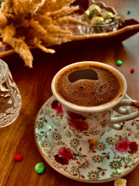 a cup of coffee sitting on top of a saucer, a picture, pexels contest winner, hurufiyya, mixture turkish and russian, 💋 💄 👠 👗, thumbnail, large)}]