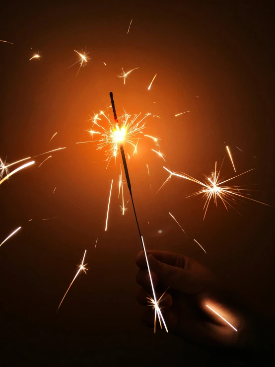 a person holding a sparkler in their hand, pexels contest winner, wizard magic staff, avatar image