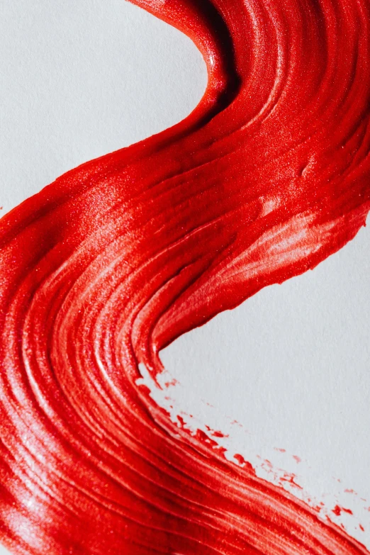 a close up of red paint on a white surface, inspired by Shōzō Shimamoto, trending on pexels, coated pleats, bright red lipstick, banner, award-winning artwork