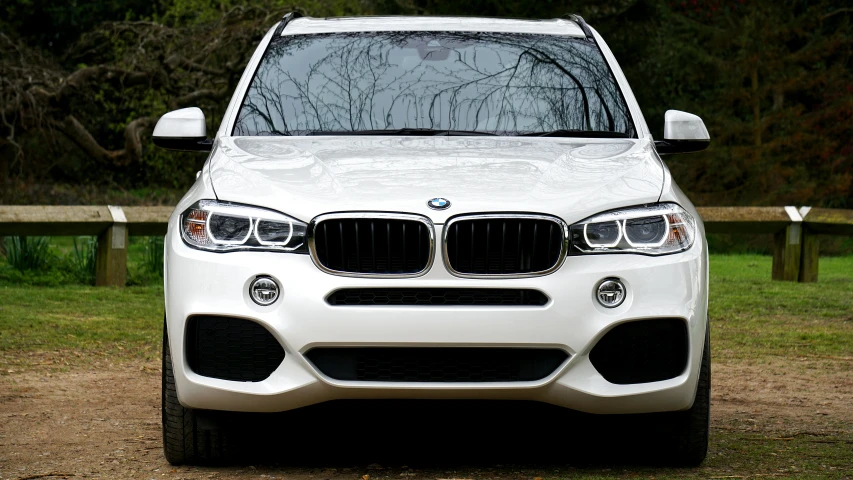 a white bmw suv parked on a dirt road, pexels contest winner, clean detail 4k, front lit, porcelain skin ”, extremely polished