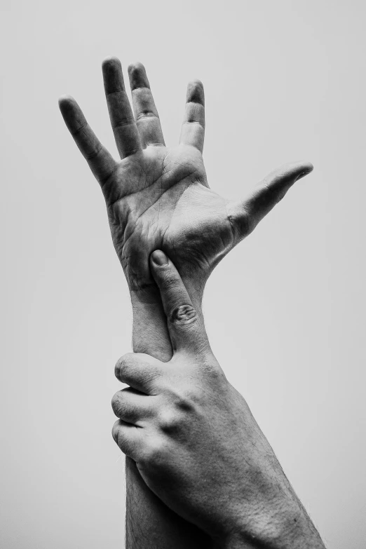 a black and white photo of two hands reaching for each other, by Doug Ohlson, hyperrealism, ignant, crossed arms, kaethe butcher, nerves
