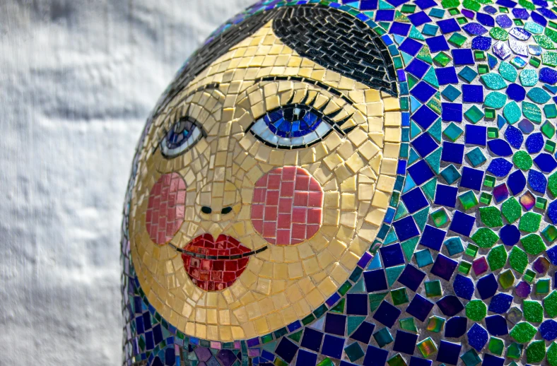 a close up of a sculpture of a woman's face, a mosaic, cloisonnism, humpty dumpty in form of egg, blue head, disco ball, nika maisuradze
