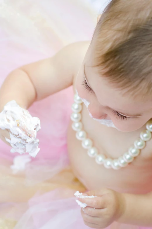 a baby in a tutu eating a piece of cake, pexels, process art, jewelry pearls, elegant lady, up-close, handcrafted