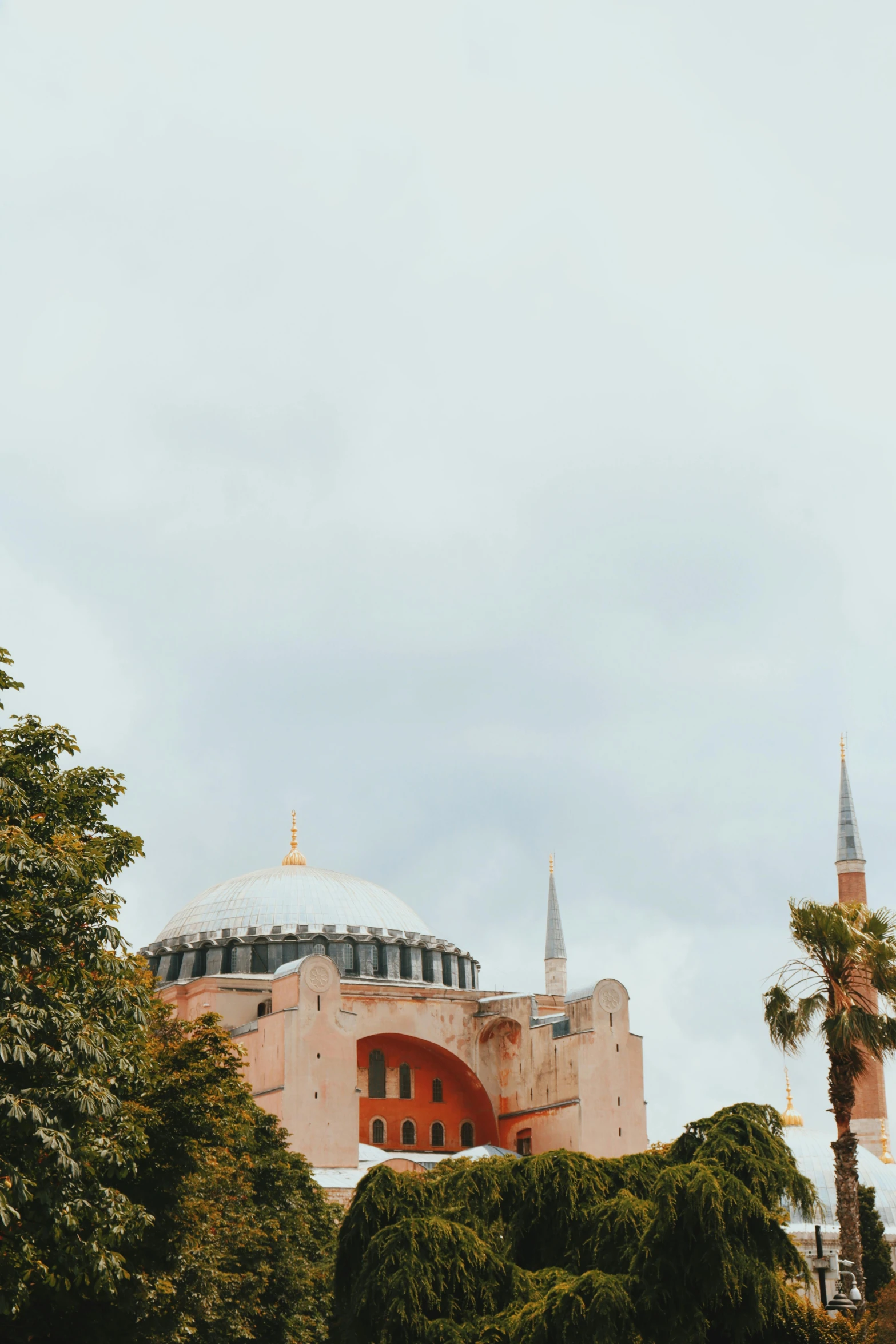 a large building with a dome on top of it, inspired by Niyazi Selimoglu, trending on unsplash, hurufiyya, byzantine, low quality photo, holiday, two towers