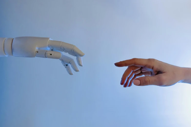 a robotic hand reaching for a human hand, trending on pexels, looking at each other mindlessly, flesh with technology, she half human and half robot, 2030