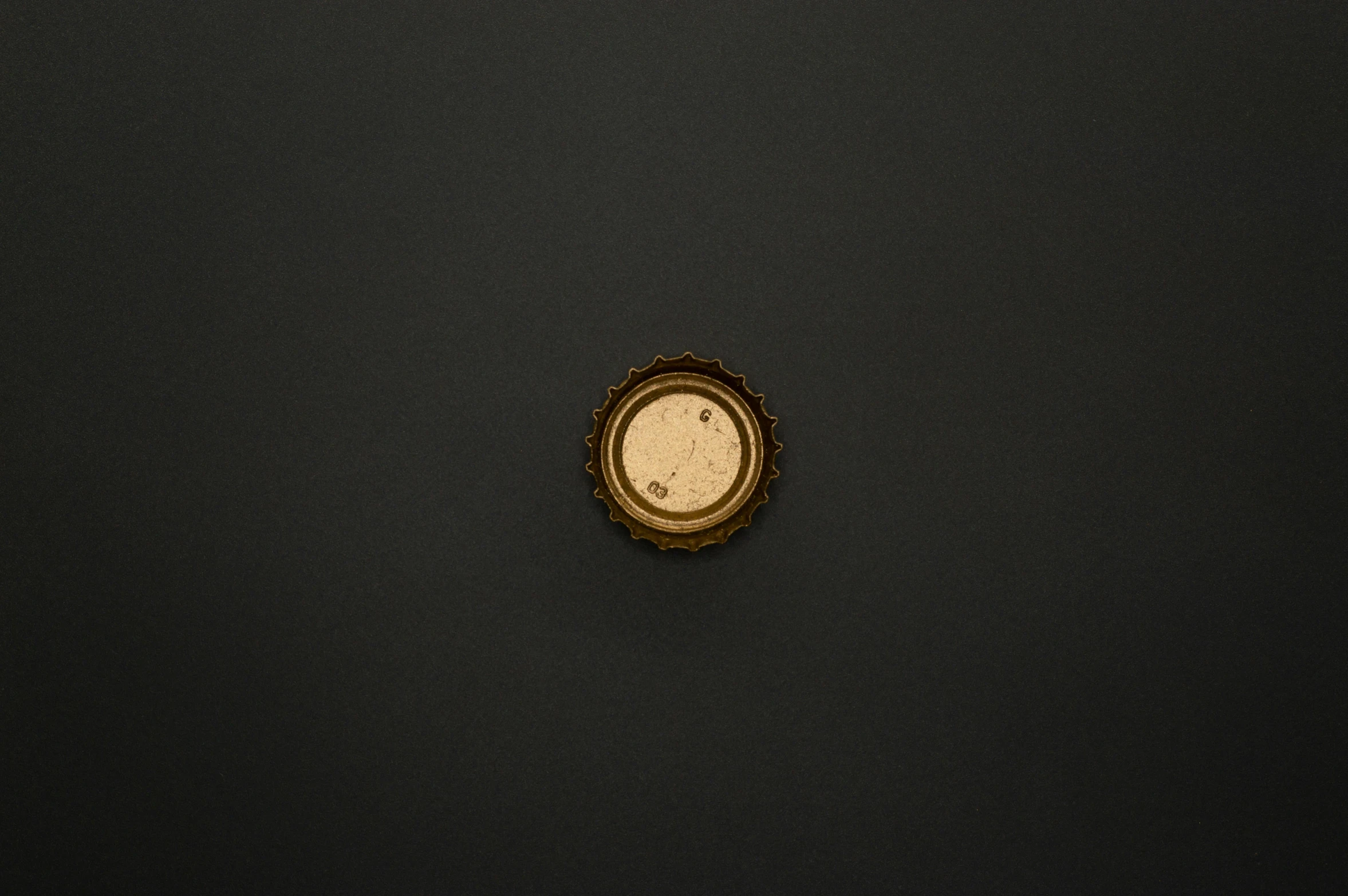 a close up of a clock on a black surface, an album cover, by Adam Chmielowski, unsplash, conceptual art, beer bottle, gold, ffffound, very minimalistic