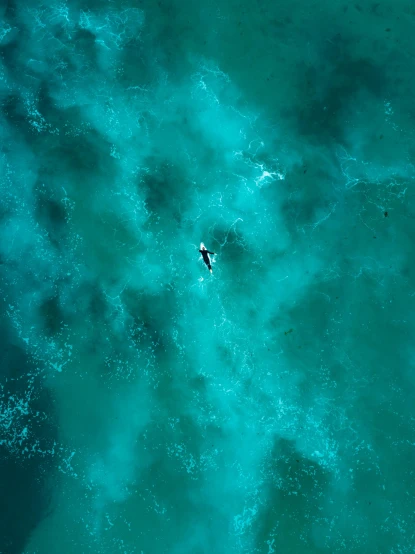 a couple of people riding surfboards on top of a body of water, by Adam Marczyński, unsplash contest winner, minimalism, helicopter view, alone in a nebula, manly, looking threatening