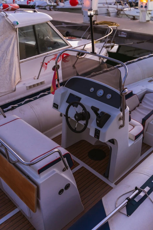 a boat that is sitting in the water, leather interior, in pilote, sunbeam, overview