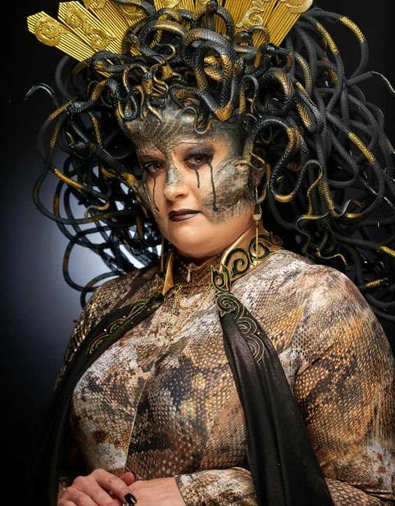 a close up of a person wearing a costume, inspired by Ursula Wood, cg society contest winner, renaissance, with snakes for hair, black and gold wires, award winning studio photo, lgbtq