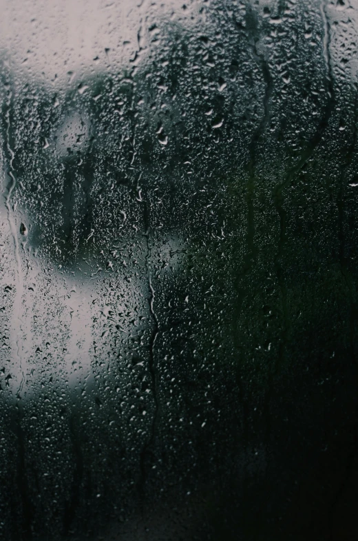 a close up of a window with rain on it, inspired by Elsa Bleda, unsplash, visual art, weeping tears of black oil, promo image, rain sensor, dark green water