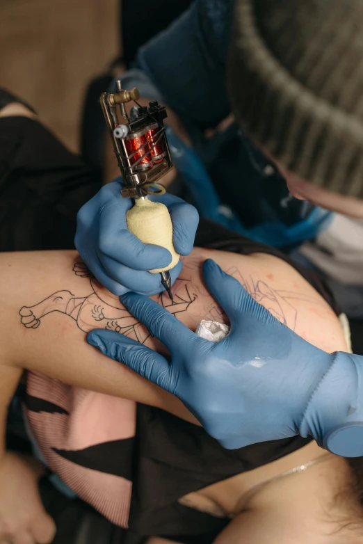 a woman getting a tattoo on her arm, reddit, process art, square, 2654465279, promo image, blue print