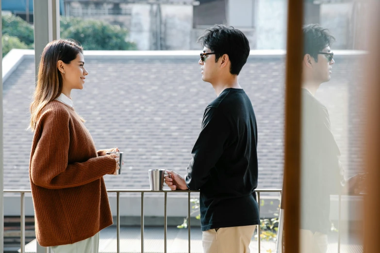 a man and a woman standing next to each other, unsplash, shin hanga, balcony scene, wearing small round glasses, morning coffee, highlight scene of the movie