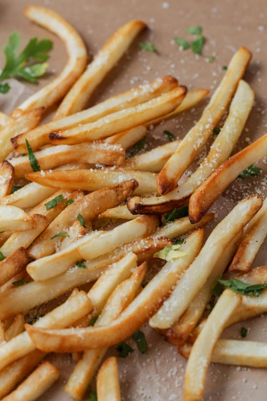 a pile of french fries sitting on top of a cutting board, mint, subtle detailing, f / 2 0, stems