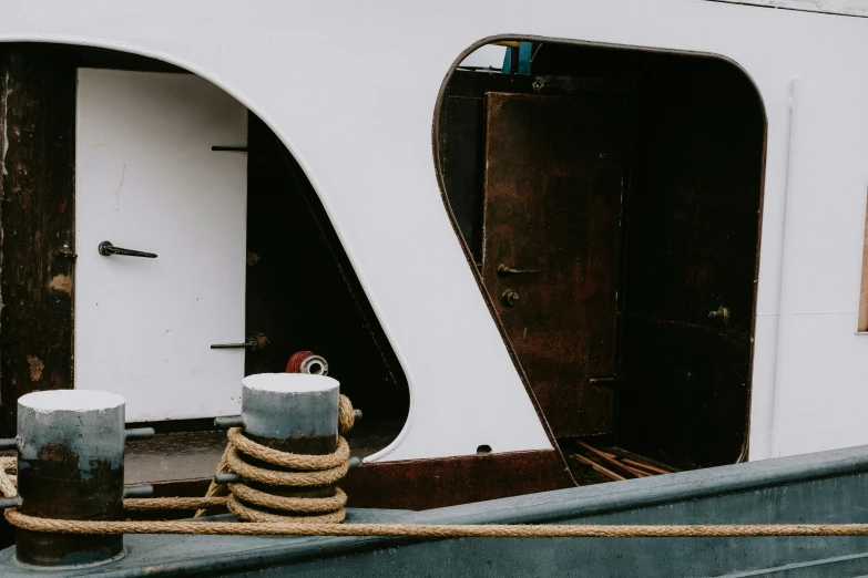 a close up of a boat on a body of water, by Attila Meszlenyi, pexels contest winner, modernism, square jaw-line, stacked image, nautical siren, rhys lee