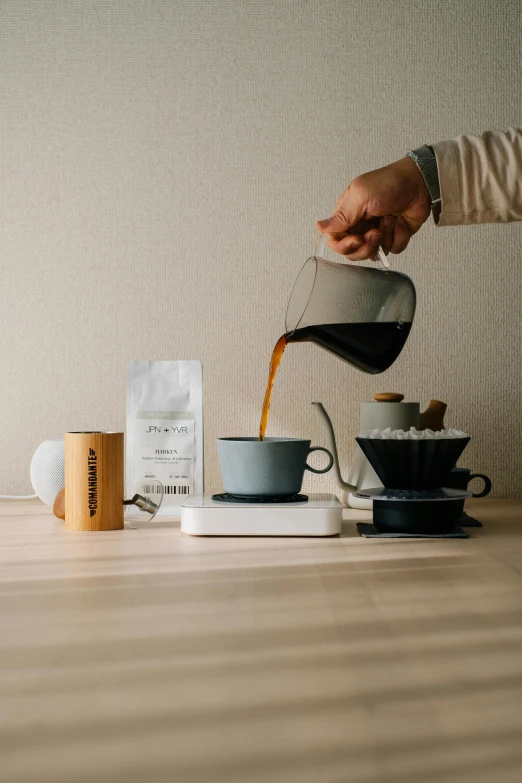 a person pours coffee into a cup, by Sebastian Vrancx, detailed product image, ingredients on the table, japandi, thumbnail