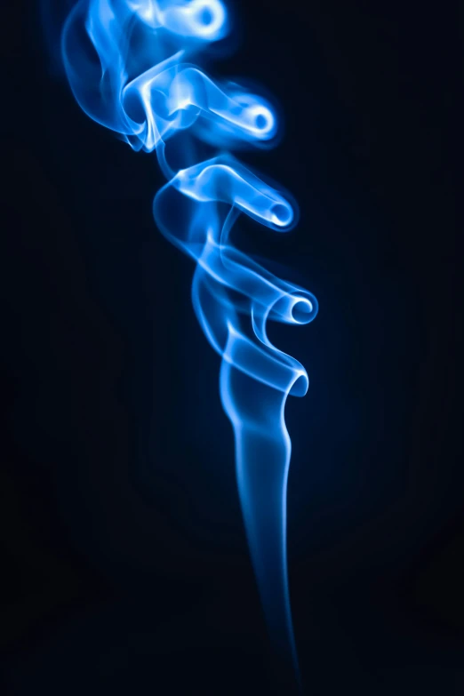 a close up of smoke on a black background, by Josh Bayer, art photography, blue fire!, award winning color photo, new mexico, curves