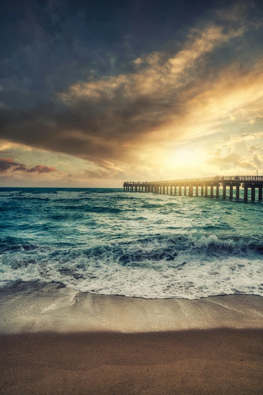 a beautiful sunset over the ocean with a pier in the background, an album cover, pexels contest winner, renaissance, stormy ocean, the emerald coast, today\'s featured photograph 4k, sun drenched