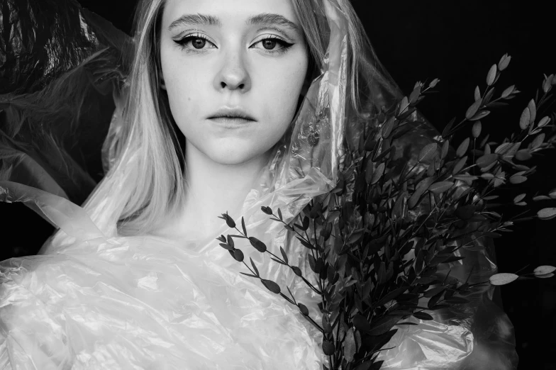 a black and white photo of a woman holding a bouquet, a black and white photo, inspired by Kati Horna, art photography, elle fanning as an android, portrait shot 8 k, ((portrait)), wearing torn white cape