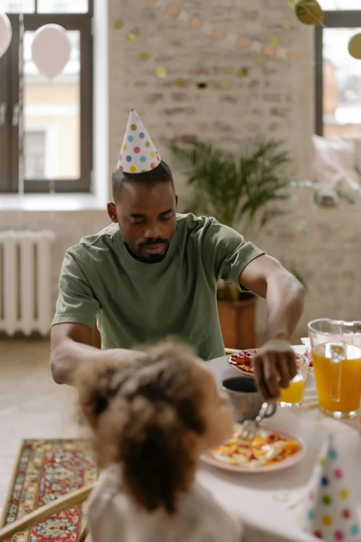 a man and a little girl sitting at a table, pexels contest winner, wearing a party hat, breakfast, black man, pals have a birthday party