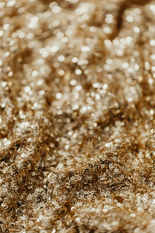 a close up view of a shiny surface, a macro photograph, by artist, reddit, visual art, gold dust, ground - level medium shot, detailed product image, gold hair