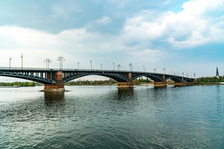 a bridge over a body of water under a cloudy sky, by Alexander Fedosav, hurufiyya, 2022 photograph, rostov city, indore, maintenance photo