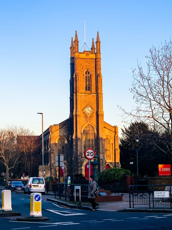 a city street with a church in the background, an album cover, by Kev Walker, unsplash, barnet, panoramic, winter sun, taken in the early 2020s