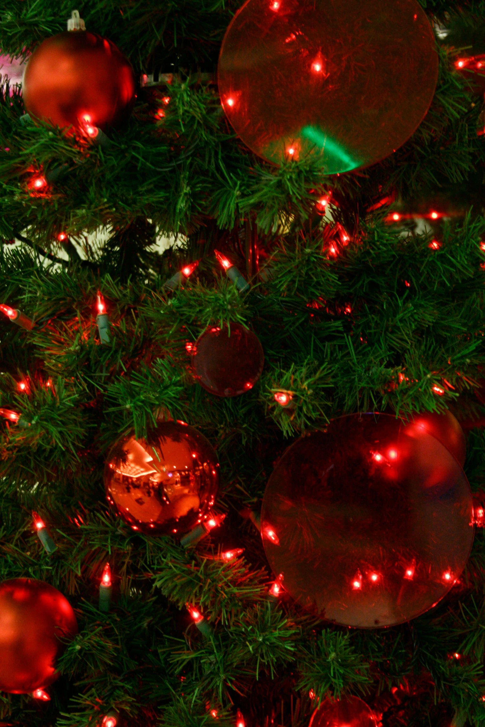 a close up of a christmas tree with red ornaments, a digital rendering, pexels, renaissance, red led lights, a green, detail shot, hi-res