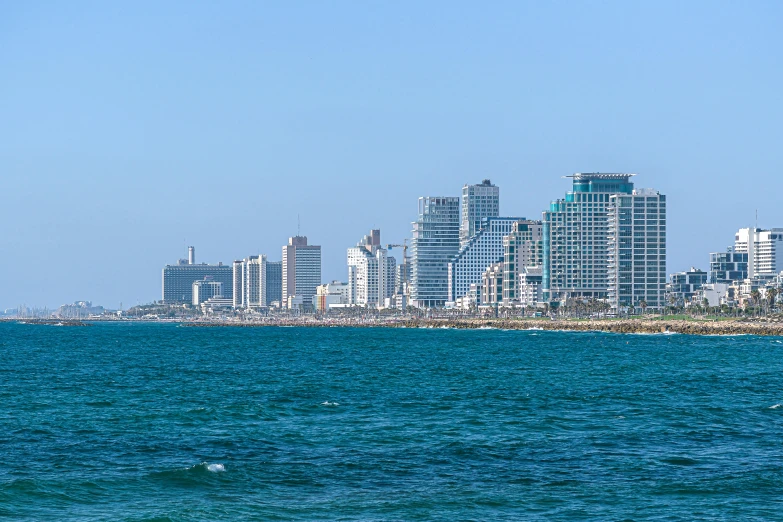 a large body of water with a city in the background, tel aviv street, fan favorite, viewed from the ocean, gigapixel photo