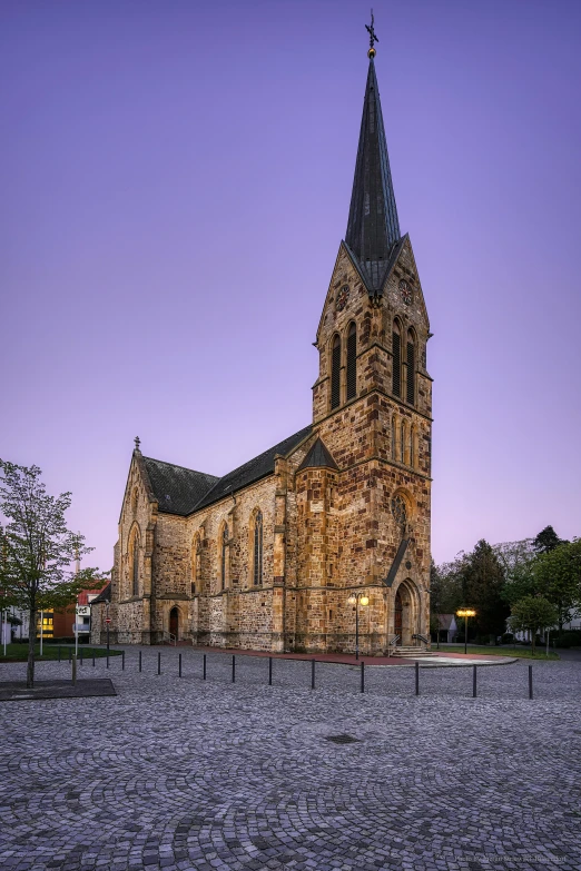 a large stone church with a steeple at dusk, inspired by Albert Paris Gütersloh, romanesque, exterior shot, square