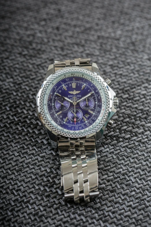 a close up of a watch on a table, a portrait, bentley, multiple purple halos, regular build, in 2 0 1 5