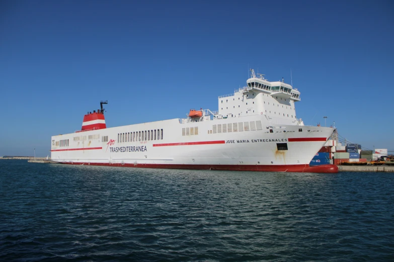 a large white and red boat in a body of water, by Jens Søndergaard, terminal, theophanes, family friendly, ship at sea