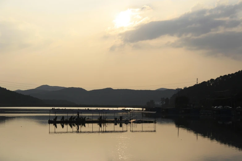 the sun is setting over a body of water, a picture, inspired by Maruyama Ōkyo, pexels contest winner, mingei, in karuizawa, grey, farming, inlets